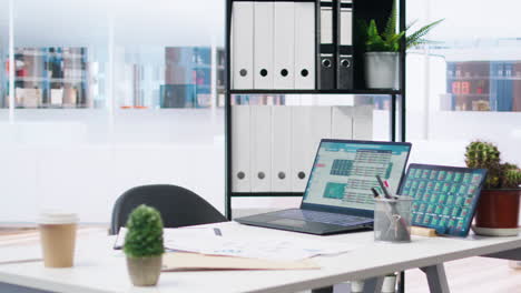 Empty-company-financial-department-with-stock-portfolio-on-laptops