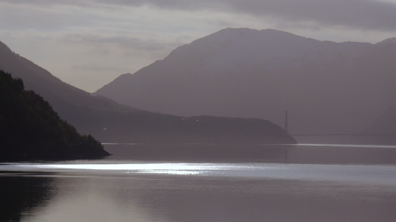 Time lapse Atmospheric shot of the Eidfjorden, Eldfjord, with Hardanger bridge in background