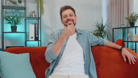 Close-up-portrait-of-happy-smiling-caucasian-man-in-shirt,-looking-at-camera,-celebrate-good-news