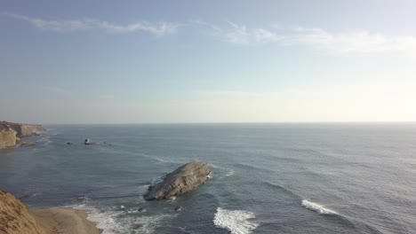 roaming aerial view of greyhound rock in davenport california