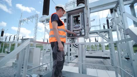 electrical engineers inspect the electrical systems at the equipment control cabinet