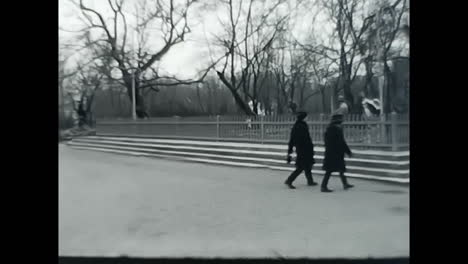 group of pedestrians strolling along a busy street in the soviet union. circa ussr 1970: a diverse group of individuals journeying on foot down a bustling street in the era of soviet socialism.