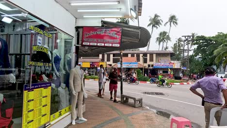 people and vehicles on a bustling street