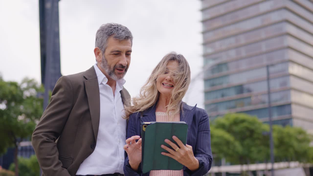 Business people looking at tablet