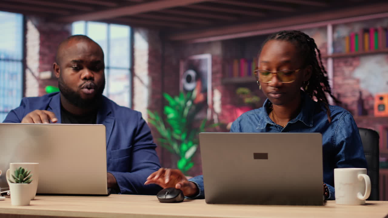African American man and woman starting a fight at home office