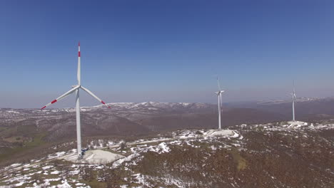 many wind turbines on top of a mountain