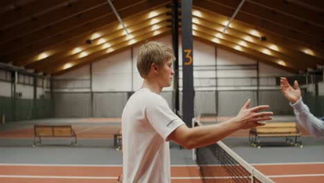 tennis players in indoor court