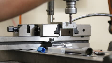 close-up of a milling machine in operation with sharp metal parts