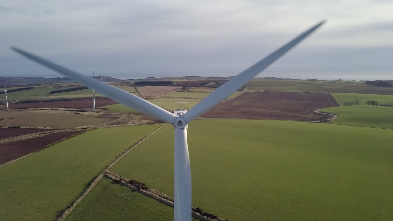 Aerial footage of a wind turbine farm in Scotland