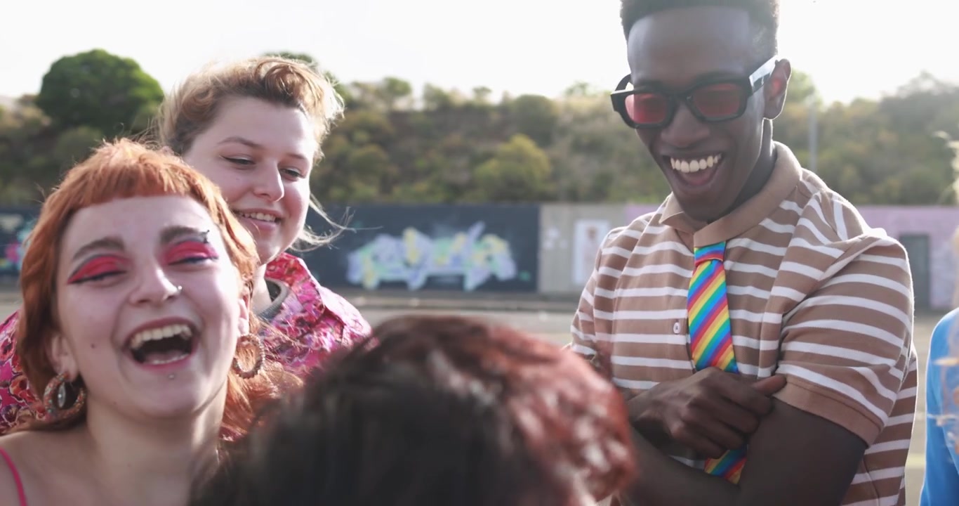Happy Diverse Young Friends Dancing and Laughing Outdoors