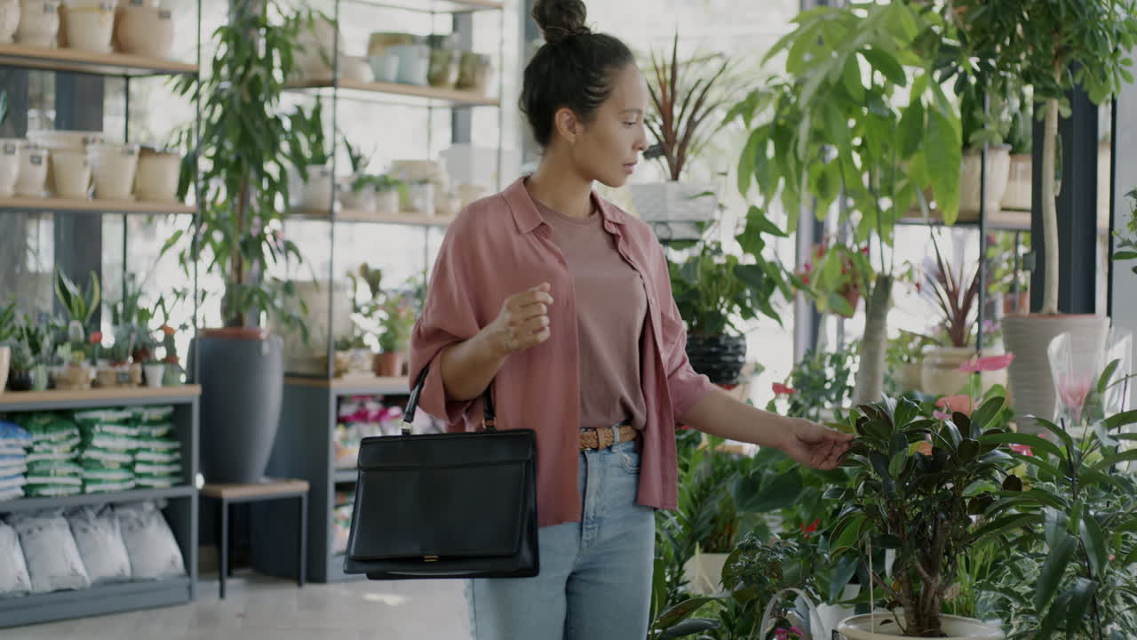 Woman Shopping for Plants in a Garden Center