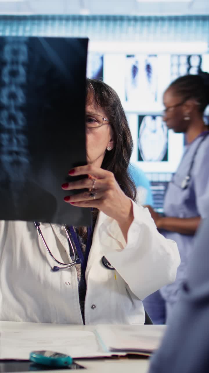 Doctor Reviewing X-Ray Images