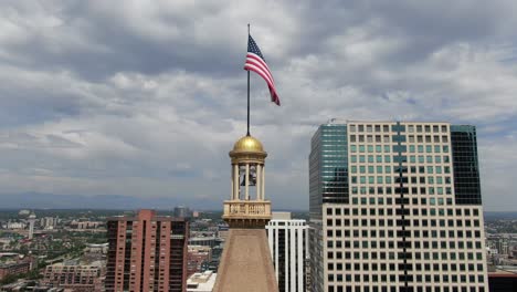 a downward pan of a tall building, denver, colorado