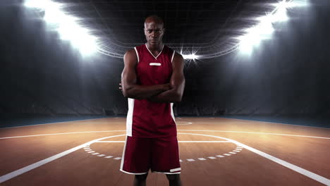 male basketball player against sports stadium in background