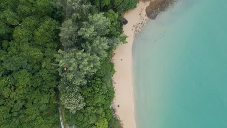 Aerial-top-shot-of-Road-near-Pasir-Tengkorak-beach,-Langkawi,-Malaysia