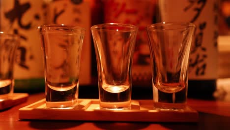 sake glasses progressively filled over time