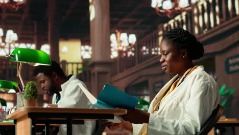 focused medical student enjoys reading a textbook on pharmacology