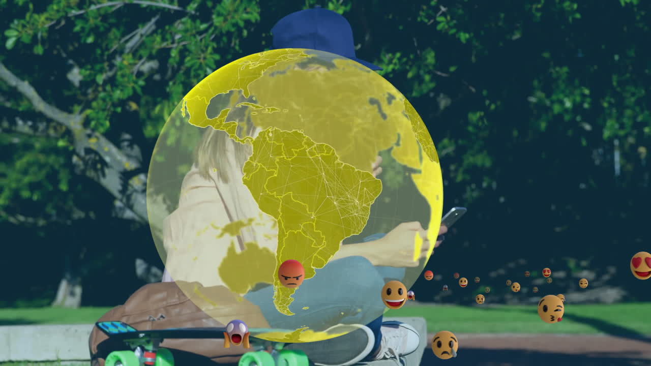 Yellow globe animation over person using smartphone outdoors with skateboard nearby