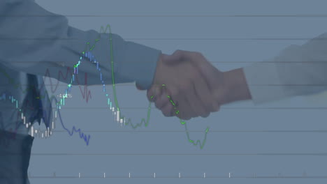 statistical data processing against mid section of two businessmen shaking hands