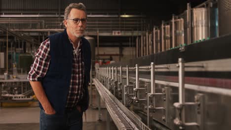 male worker working at bottling plant