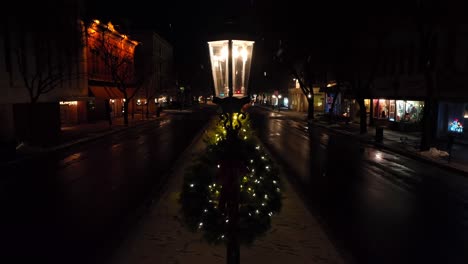 aerial orbit around lamp post with christmas wreath