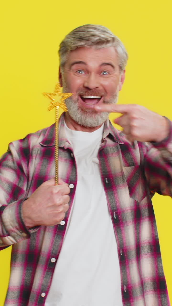 Magician witch caucasian man gesturing with magic wand making wish come true casting magician spell