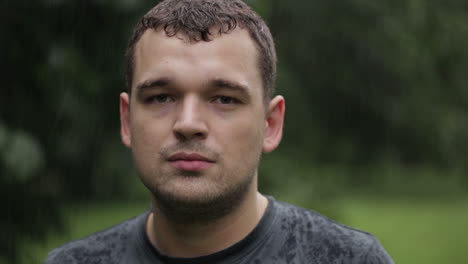 young man under the rain