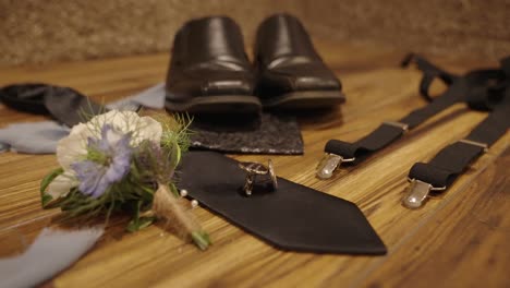 shoes, tie, suspenders, rings, and other accessories for the groom