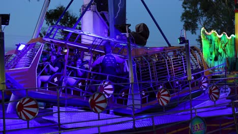 people enjoying a vibrant amusement ride