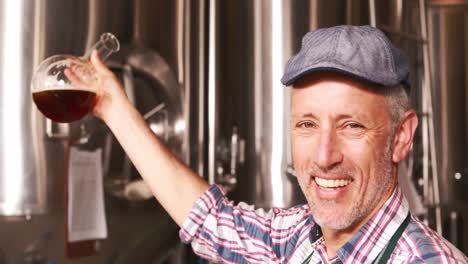 brewery worker checking the product