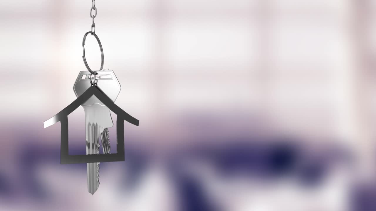 Animazione di chiavi di casa d'argento pendenti su sfondo sfocato con spazio per il testo.