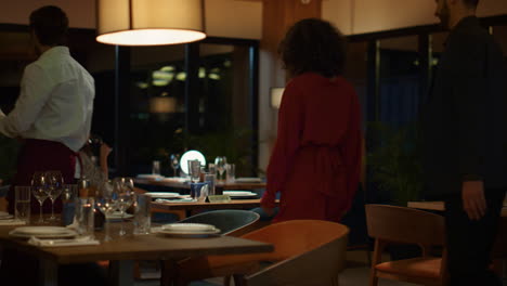 Restaurant-waiter-serving-couple-on-fancy-evening-dinner-date.-Romantic-concept.