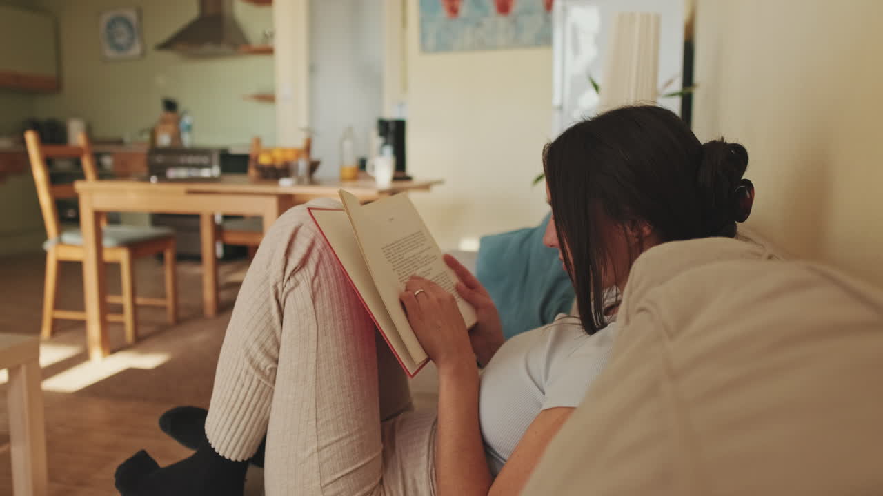 Woman Reading a Book at Home