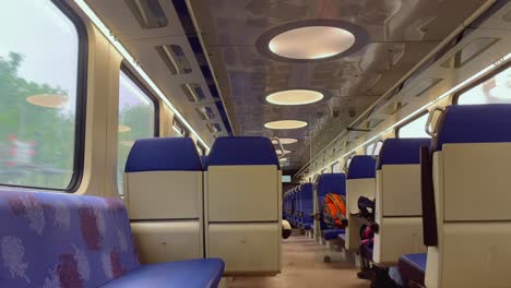 modern interior of dutch ns train that runs without passengers handheld