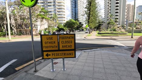 people navigate around a closed footpath