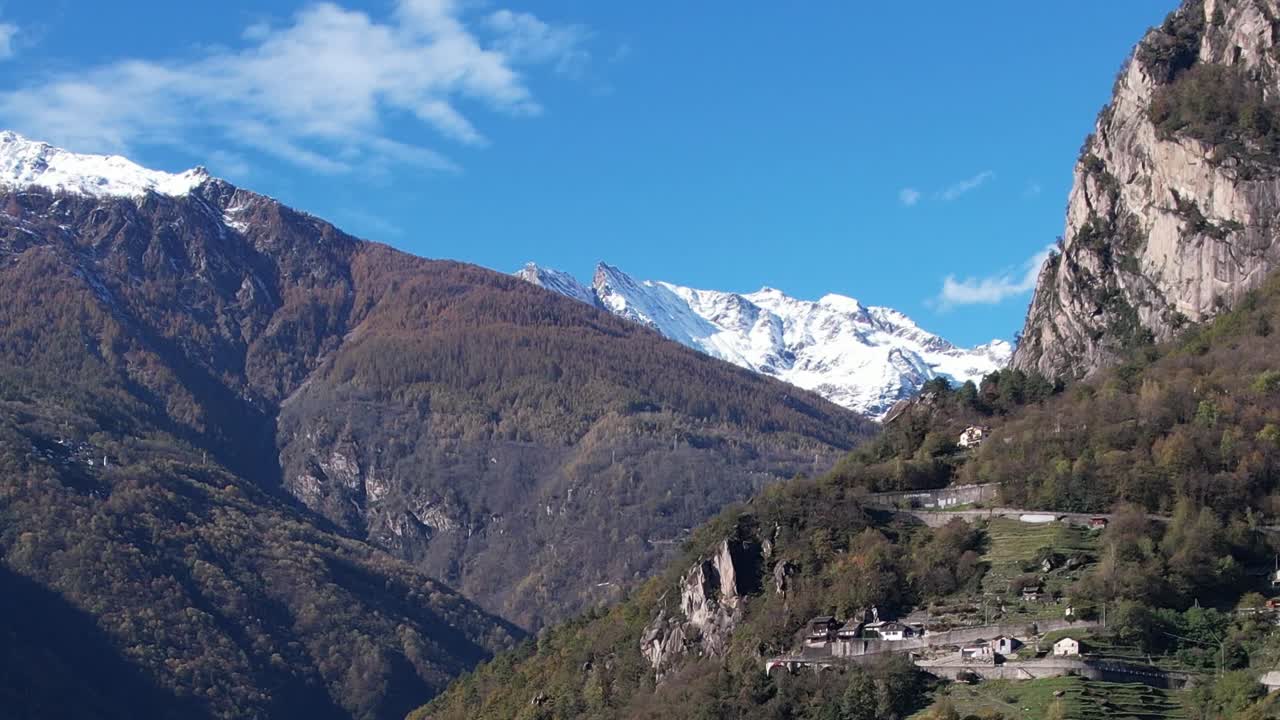 Stunning aerial view of the Alps mountains in Italy with lush valleys