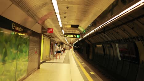 people waiting at a naples metro station