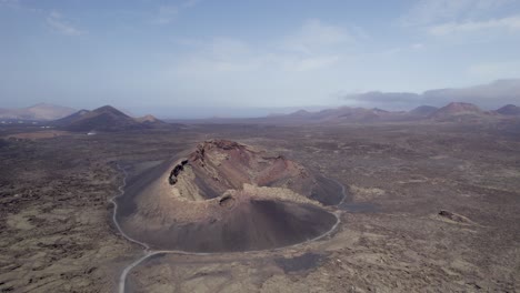 aerial shot of old dormant volcano and volcanic landscape, lanzarote island