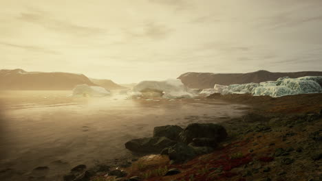 golden hour light illuminating a serene iceberg landscape by the coast
