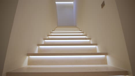 slow revealing shot of led-lined steps within a home