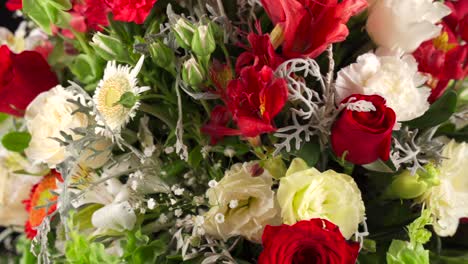 floral arrangement close up macro shot red and white roses and lily spinning