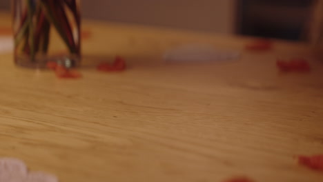 woman giving heart-shaped gift box