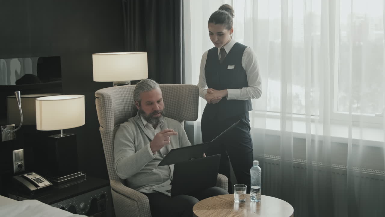 Businessman Ordering Meal in Hotel