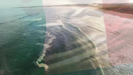 Animación-De-La-Bandera-De-Italia-Ondeando-Sobre-El-Paisaje-De-La-Playa.