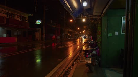 Rainy-evening,-rainy-street,-wet-road,-light-reflections,-shot-in-Koh-Samui-island,-Thailand