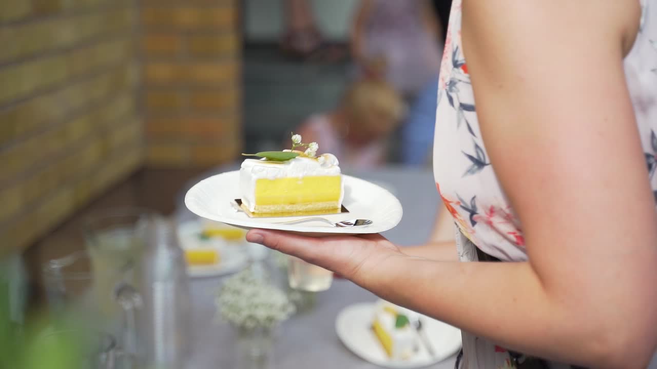 Wedding Guests At Food Table Grabbing Drink And Cake Slice. Slow Motion, Follow Shot