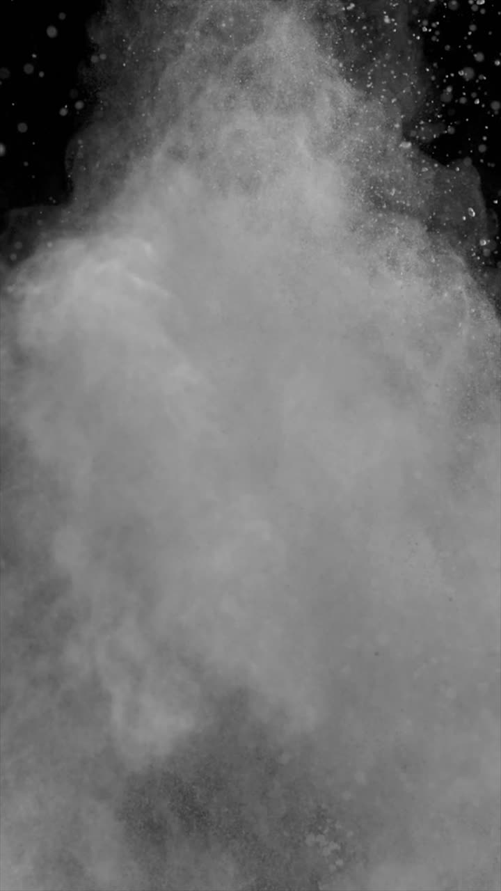 White Powder Exploding on Black Background Vertical Video 4k