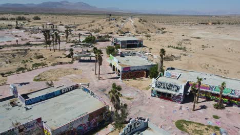 drone view of abandoned buildings in desert