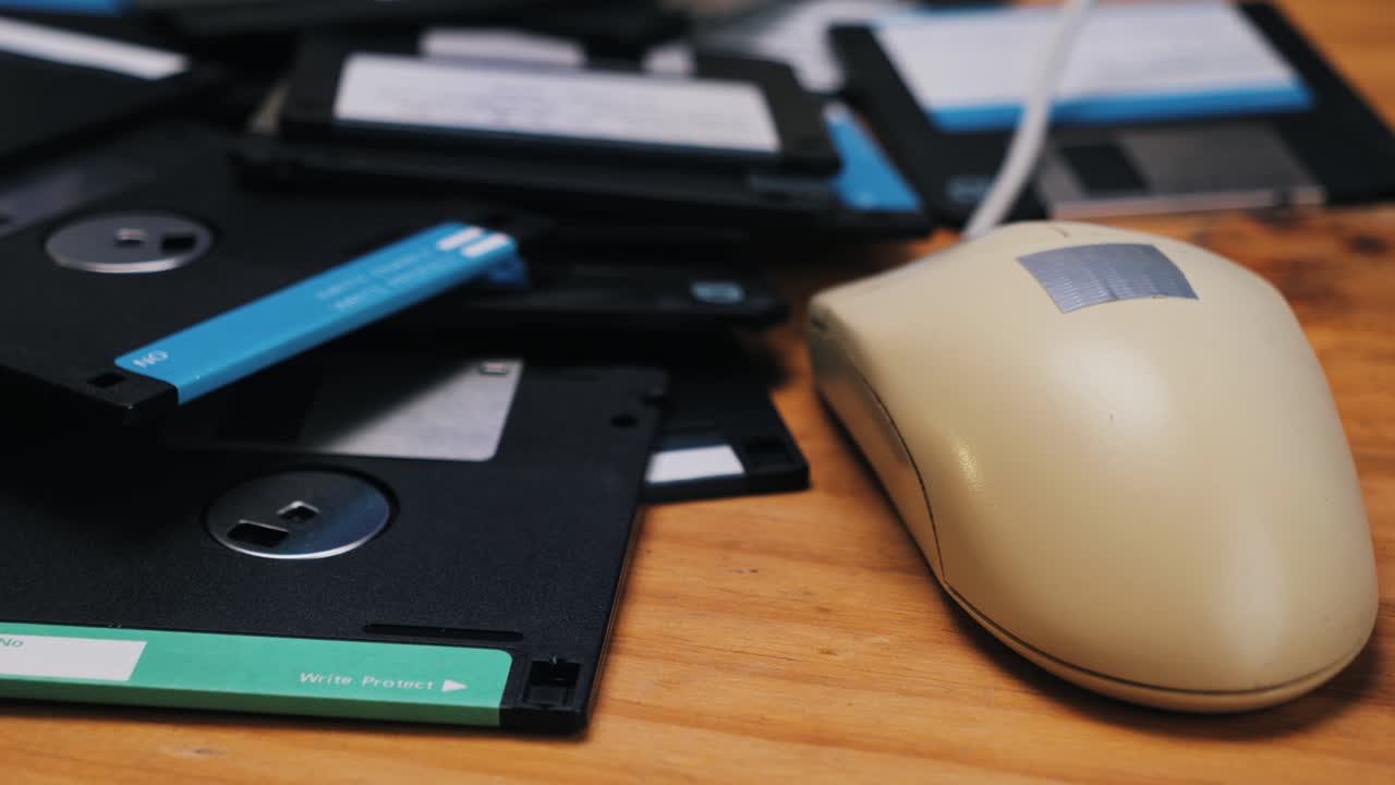 Vintage Computer Mouse and Floppy Disks