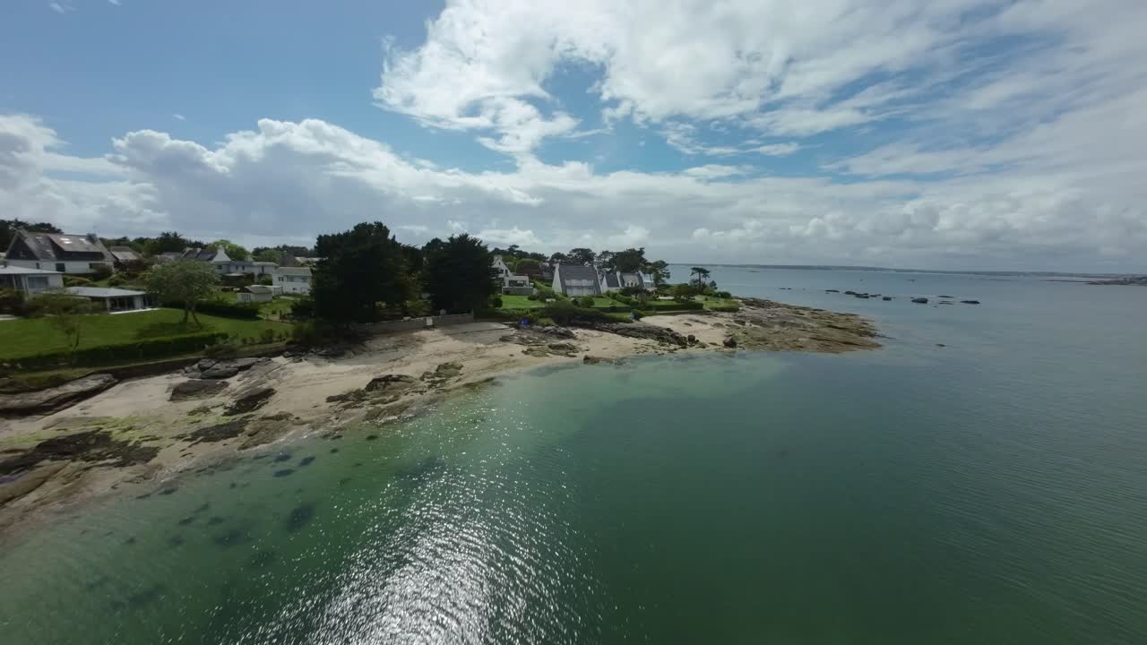 Aerial View of Coastal Houses and Beach